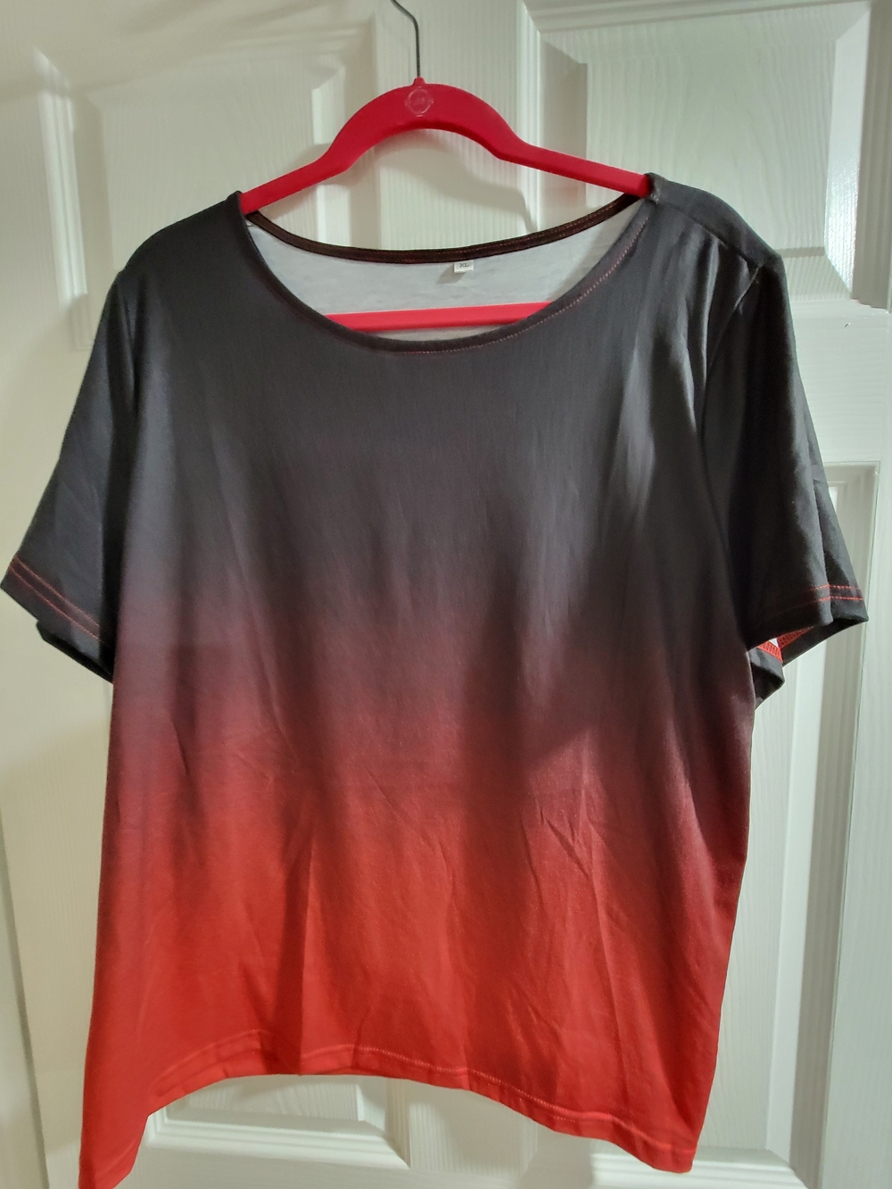 Vibrant short sleeve t-shirt has a black to red ombre gradient design. Size XL